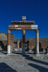 View of columns at the ruins of the Forum on a sunny day with clear blue sky, Pompeii, Campania, Italy