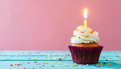 Minimalist Cupcake with Candle and Sprinkles on Pink Background