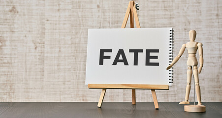 There is notebook with the word FATE. It is as an eye-catching image.