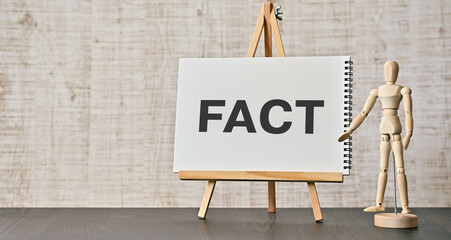 There is notebook with the word FACT. It is as an eye-catching image.