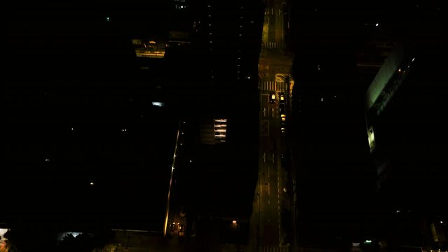 Aerial Top Upward Shot Of Dark Residential Buildings In City At Night - Hong Kong, China