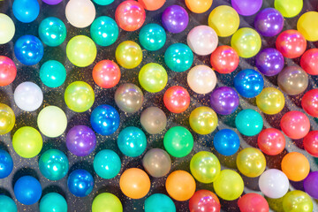 Fototapeta na wymiar Colorful balloons background. Many multicolored balls on black background