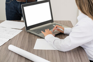 Fototapeta premium Discussion of projects and strategies. A business meeting at an engineering firm, where professionals discuss projects and delivery dates.