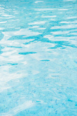 Blue pool water reflections from sun