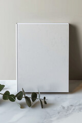 Minimalist Presentation: Blank Book with Plant Decor