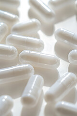 Pure White Capsules Bathed in Soft Light - obrazy, fototapety, plakaty
