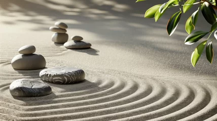 Photo sur Aluminium Pierres dans le sable Zen garden with stacked stones and raked sand patterns
