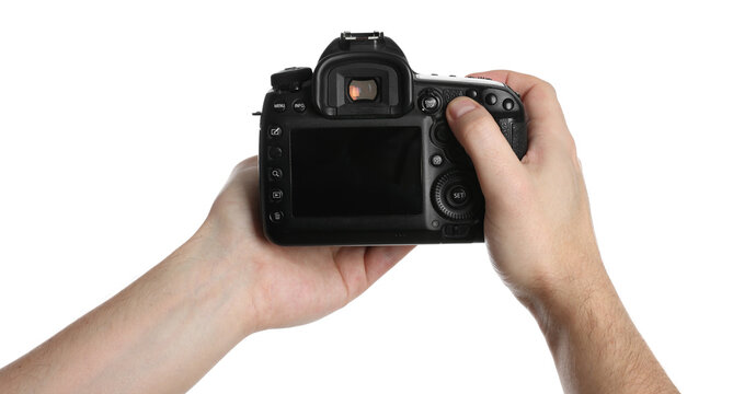 Photographer holding modern camera on white background, closeup