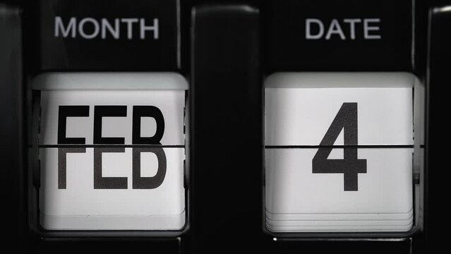 retro flip calendar with a date change from the third of February to the fourth of February. daily calendar with a change of days of the month. calendar concept, reminders, events. close up.