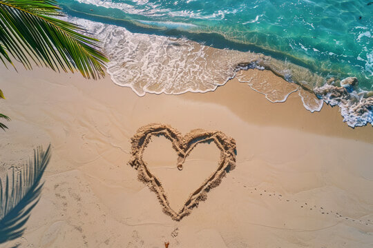 A romantic love heart drawn in the sand on a beautiful beach