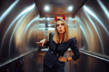 Devil Woman Going to the Basement with an Elevator. Evil boss going down in infernal workplace...