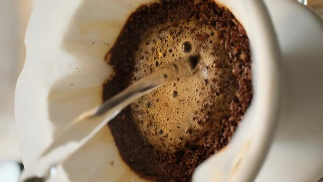 brewing coffee with the v60 method, vertical video