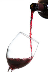 Action shot pouring red wine into a glass over a white background - 786753341