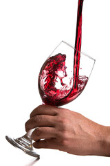 Action shot pouring red wine into a glass over a white background - 786753383