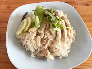 rice with chicken and vegetables on white plate
