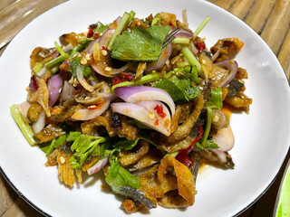 spicy salad of crispy fish with seafood, thai food