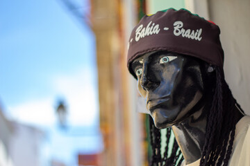 SALVADOR - BAHIA, BRAZIL – APRIL 10 2024: Face of a mannequin in black clothing with a cap of the...