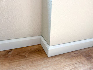 Installing Vinyl Baseboards in a Modern Home Renovation Project - 786757342