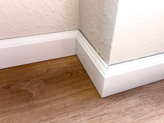 Installing Vinyl Baseboards in a Modern Home Renovation Project - 786757953