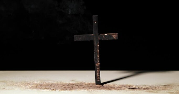 Burnt down cross symbol