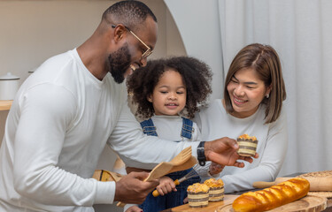 Multiracial Family Spending Quality Time Together Baking Bread in a Cozy Kitchen Setting