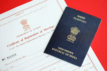 Indian Certificate of registration of marriage blank document and indian passport on table close up