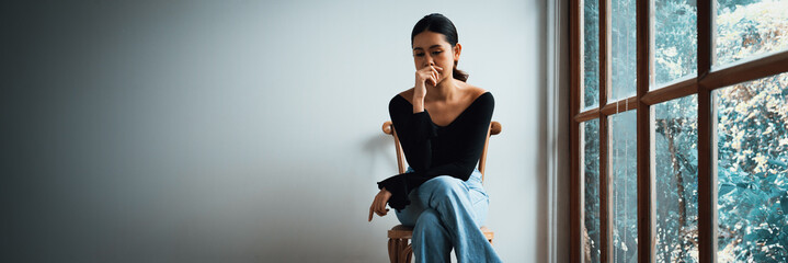 Depressed young Asian woman with mental health problem in mind need uttermost treatment from overthinking fatigue, disruptive thought, dissocial, anxiety and other mental health disorders . - obrazy, fototapety, plakaty