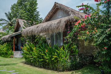 Lush Tropical Garden with Thatched Roof Villas and Flowers Perfect little house in Bali