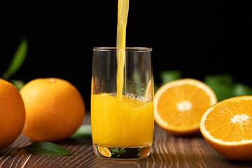 Fresh Orange Juice Being Poured in a Glass