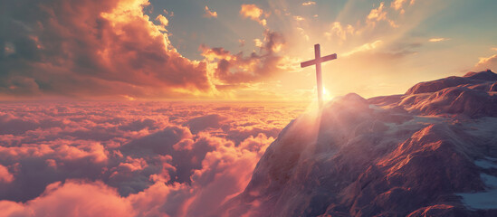 A crosses on the top of the mountain at sunrise, religion concept.
