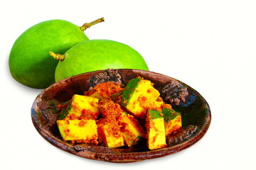 indian gujarati food recipe mango pickle with fresh green mango,cutout in white background