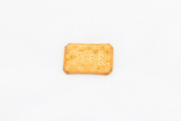A single piece of salty cracker in rectangular shape on white isolated background with copy space.