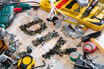 DIY abbreviation composed of screws and self-tapping screws, surrounded by various construction...