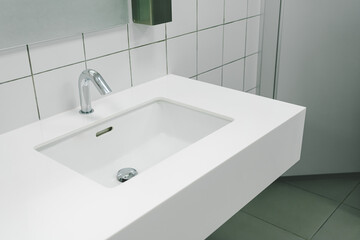 Bathroom interior with sink and faucet. Modern washbasin with chrome faucet