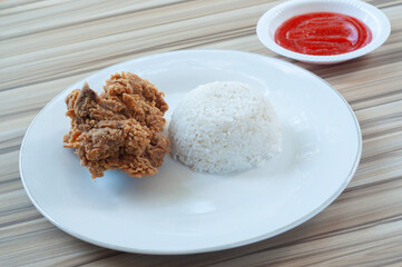 Fried Chicken with white rice and Vegetables as garnish