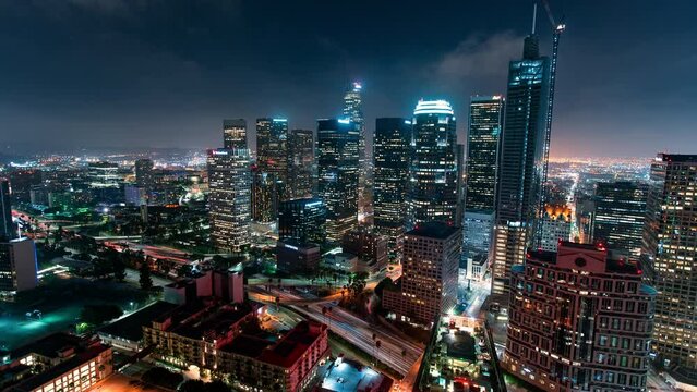 Aerial: Drone Lockdown Time Lapse Shot Of Illuminated Skyscrapers In City At Night - Los Angeles, California