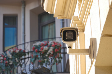surveillance camera on a wall. 