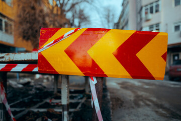 Red and yellow Safety Reflective Road Sign on Construction Site. Work in progress being marked with...
