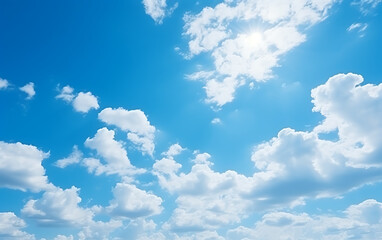 Naklejka na ściany i meble blue sky background with tiny clouds and bright sun,