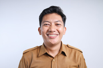 Closeup Shot of Smiling Male Government Worker Wearing Brown Uniform Over Gray Background