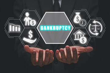 Bankruptcy concept, Businessman hands holding crisis, debt, creditor, legal process, bank and moratorium icon on virtual screen. - obrazy, fototapety, plakaty