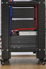 A telecommunications rack with Ethernet switches for connecting to the Internet. Audio amplifiers...