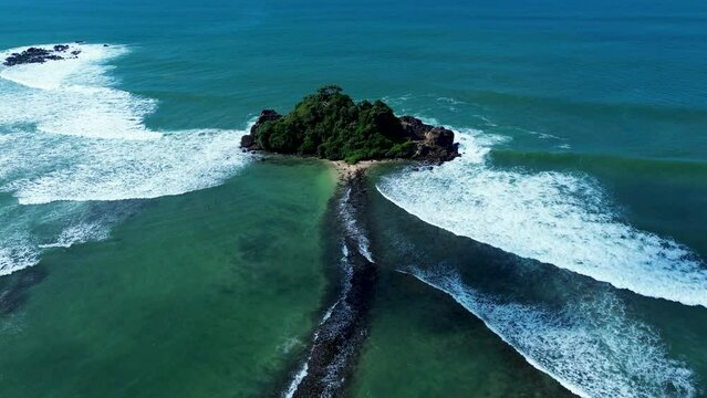 Aerial drone Devil Rock Midigama surfing Indian Ocean waves sandy beach channel inlet clear water Sri Lanka tourism travel holidays Asia