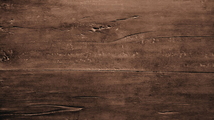Rough and aged hardwood background with a dark brown gradient. For backdrops, banners, frames,...