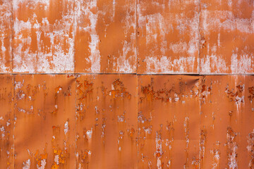 bright orange paint of rusty metal wall. industrial background with peeling paint texture. - 786827756