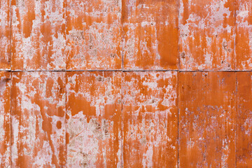 rusty metal sheet painted red. shabby background of industrial building wall. - 786827763