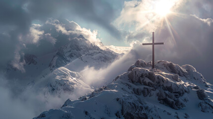 A mountain with a cross on top and a sun shining on it
