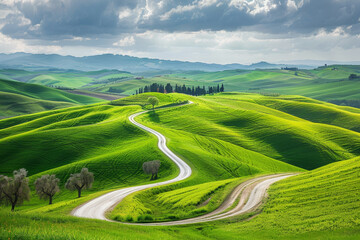 A winding road cuts through a lush green hillside
