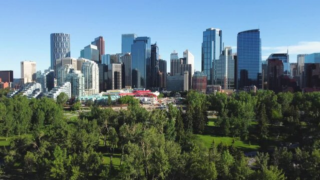 Downtown Calgary, Alberta, Canada skyline. Prince Island Park. Wide aerial drone view, from the North on a clear sunny blue sky day.