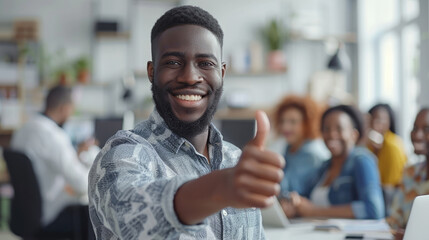 Portrait of happy African American business leader in casual shirt giving thumbs up, group of diverse office workers are in blurry background - Powered by Adobe
